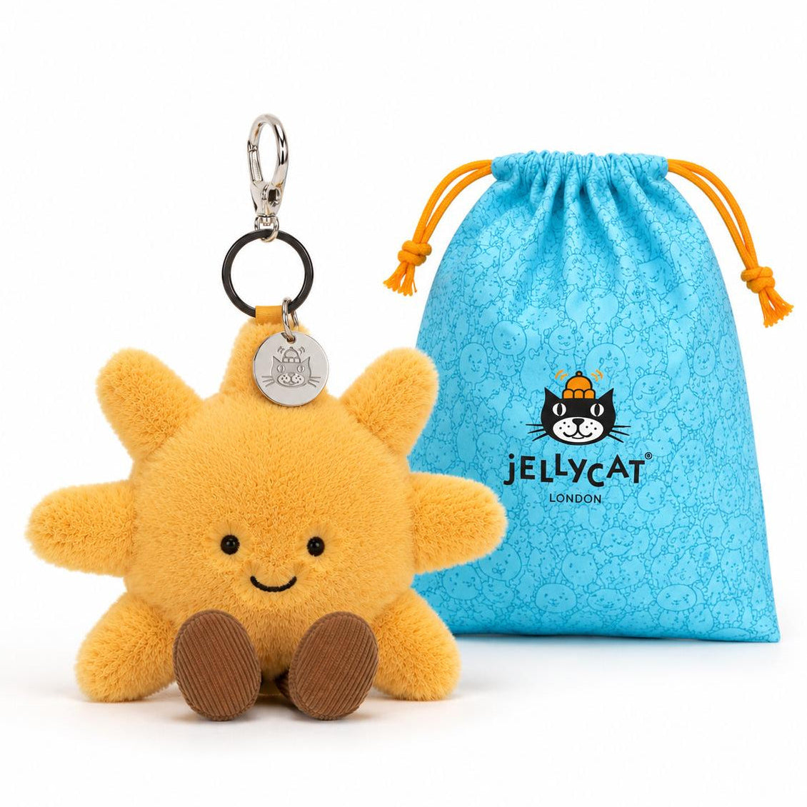 Plush sun-shaped keychain with a branded blue pouch on a white background