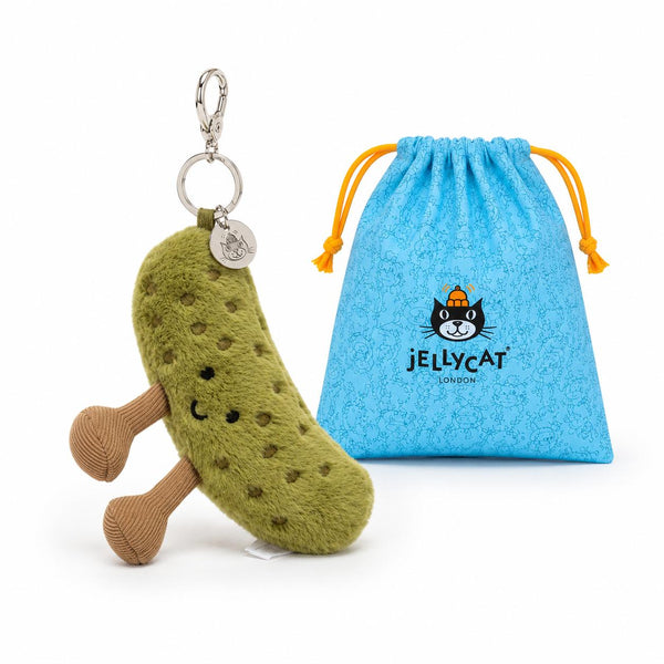 Plush pickle keychain with a blue drawstring bag featuring logo on a white background